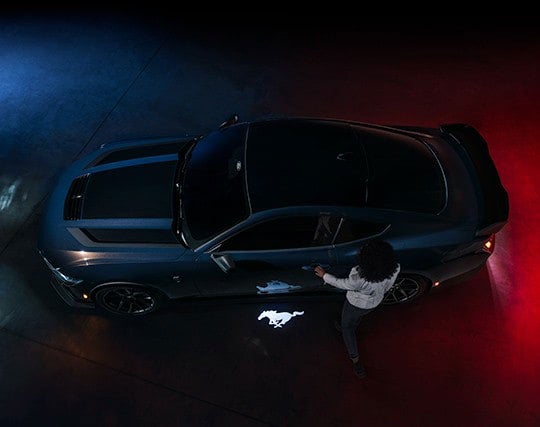 2024 Ford Mustang® Dark Horse™ model with a driver approaching the vehicle | Benton Ford in Benton KY