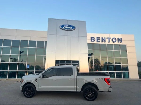 Photo of the front of the Benton Ford dealership with a Ford F150 in the forefront